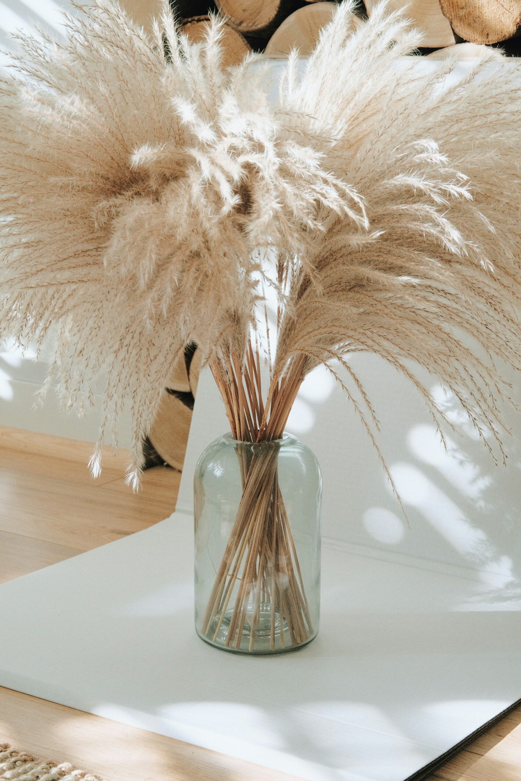 The Amazon Faux Pampas Grass That Looks Real and Never Sheds Pampas grass arrangement in a glass vase on a wooden table